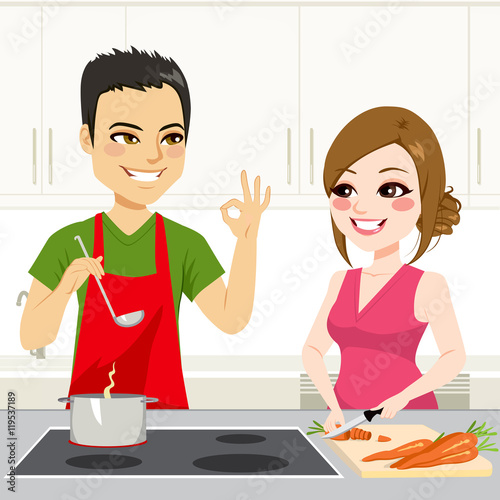 Cute young couple cooking a stew together on kitchen