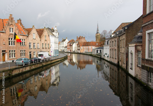 The view of the canals and the historic quarter of Bruges cloudy autumn morning. Bruges is one of the oldest and most beautiful cities in Europe