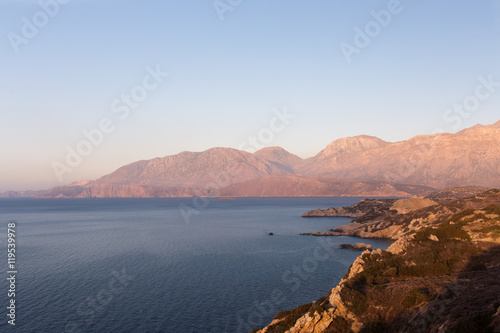 Beautiful and peaceful sea with mountains at sunset