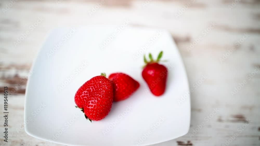 Fresh and ripe strawberries on a wooden table- hd video