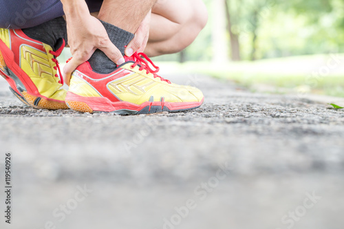 Sports injury. Pain in ankle while jogging © comzeal