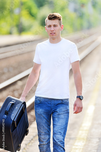 The young man at the railway station.