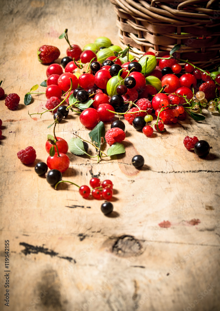 Basket with berries. On wooden table. Basket with berries. On wooden table.