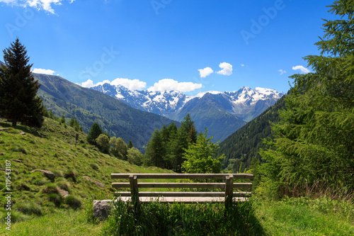 Panorama view with bench and alpine mountains from Adamello Alps, Italy © johannes86