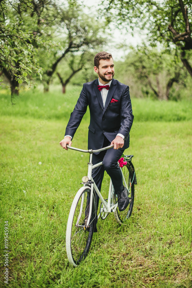 Businessman or groom on bicycle