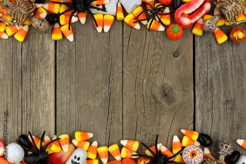 Halloween candy and decor double border against a rustic wood background