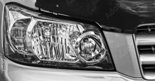 Closeup headlights of car. Car exterior detail.