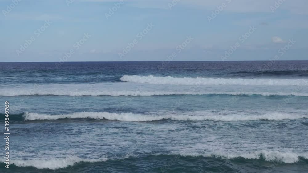 Surfers at blue point Uluwatu, Bali, Indonesia Surfers at blue point Uluwatu, Bali, Indonesia
