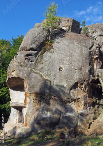 Rocky complex with caves near the village of Bubnishche in the Ukrainian Carpathians photo