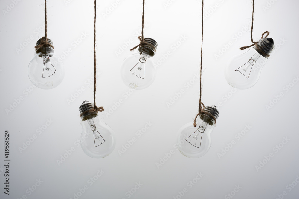 five incandescent light bulbs on a white background five incandescent light bulbs on a white background