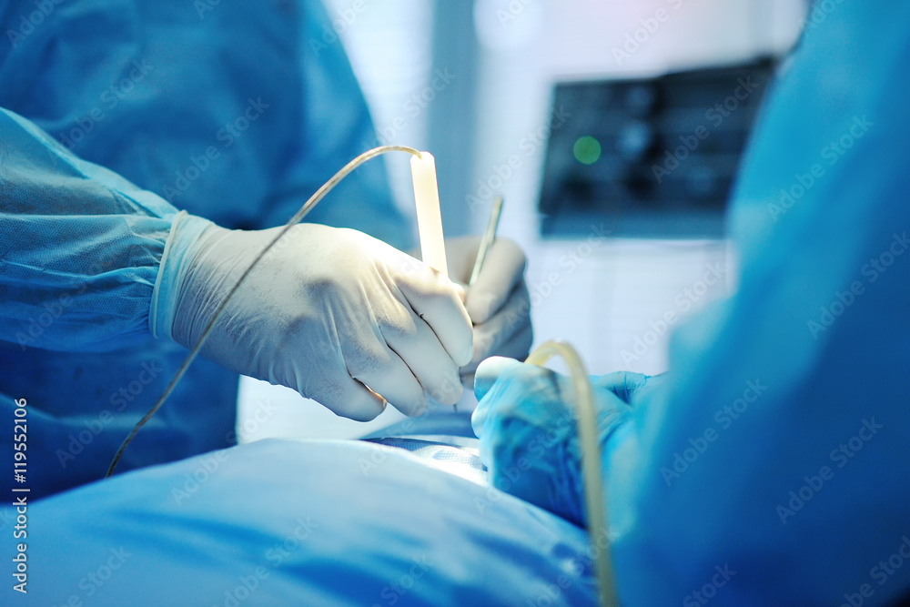 hand surgeon makes an operation closeup. surgical instruments hand surgeon makes an operation closeup. surgical instruments