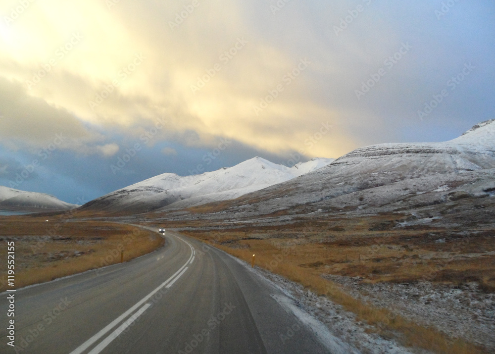 On the Country Road through Snow Capped Mountain, Iceland 
