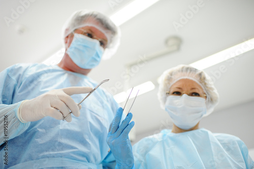 surgeons operate on a patient in the background Surgical Lamp