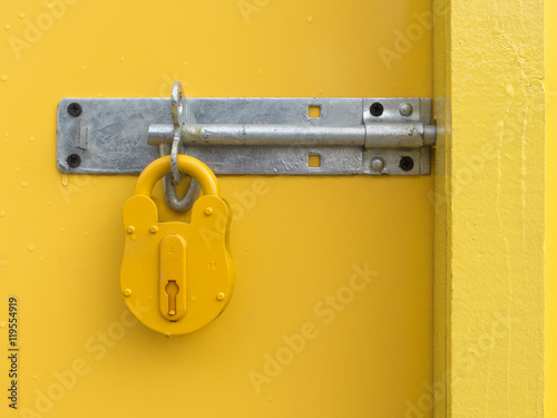 Yellow Padlock on Yellow Door