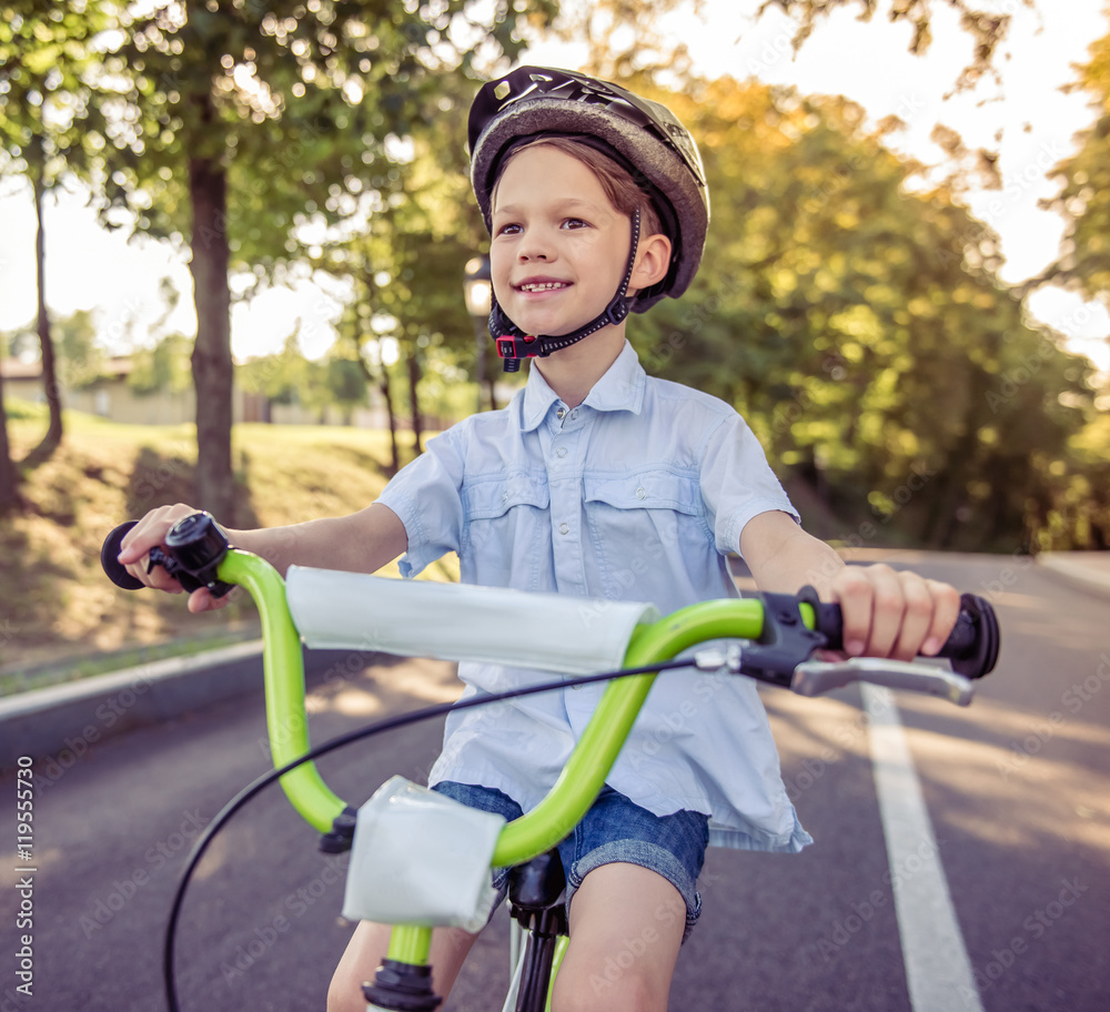 Naklejka premium Boy riding bike