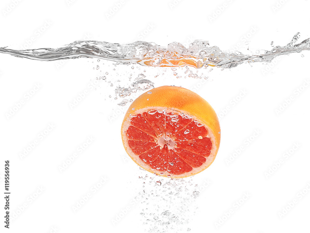 Grapefruit in water on white background