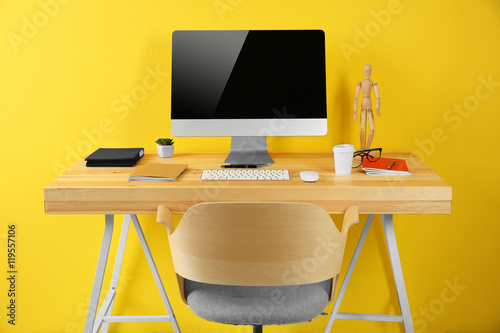 Working place on yellow wal...
