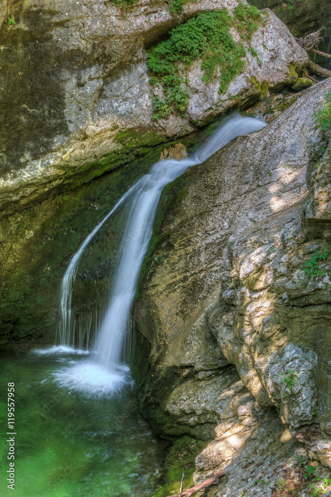 Obraz premium The canyon Mostnica (Korita Mostnice) with crystal clear water and Mostnica waterfall in Triglav national park, Slovenia