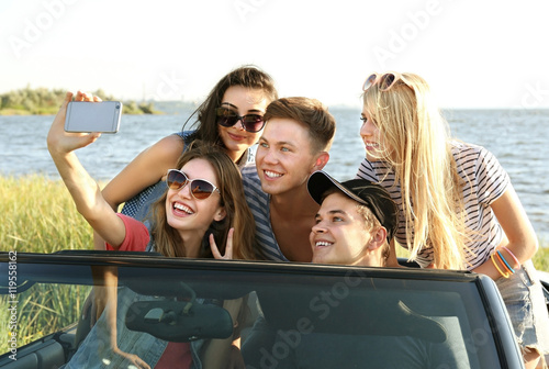 Happy friends taking selfie...