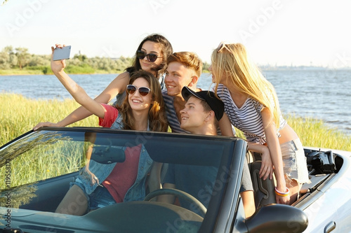 Happy friends taking selfie...