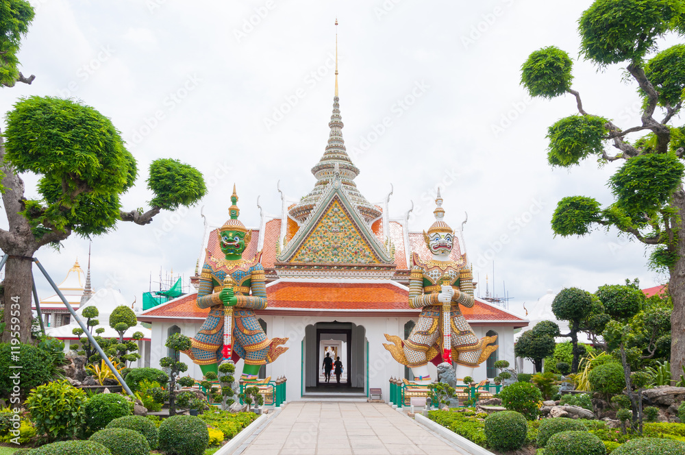 Entrance to Wat Arun buddhist temple,Wat Arun Ratchawararam or the Temple of Dawn. Thailand iconic decorated by ceramics ,Giant statue in wat arun bangkok thailand ,Amazing Thailand Entrance to Wat Arun buddhist temple,Wat Arun Ratchawararam or the Temple of Dawn. Thailand iconic decorated by ceramics ,Giant statue in wat arun bangkok thailand ,Amazing Thailand