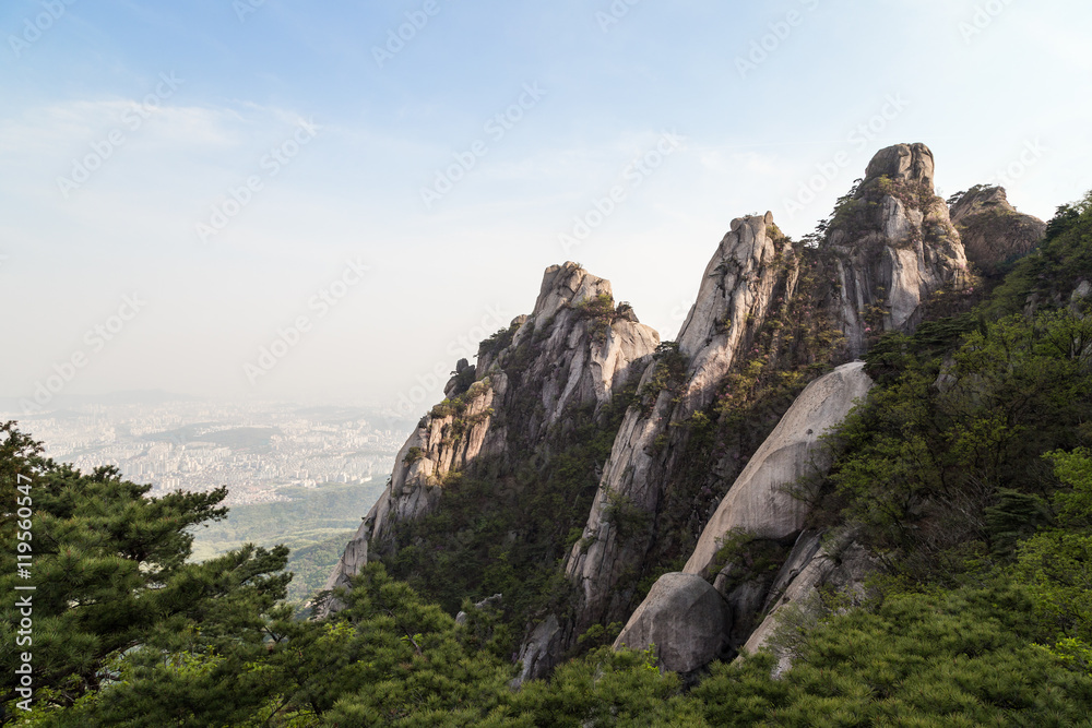 View of steep granite peaks of Jaunbong Peak on Dobongsan Mountain at the Bukhansan National Park in Seoul, South Korea. Copy space.