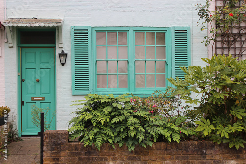 Turquoise door and window house. 