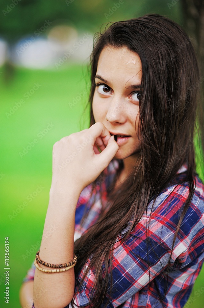 Very beautiful brown-eyed girl-teenager with long wet hair and d