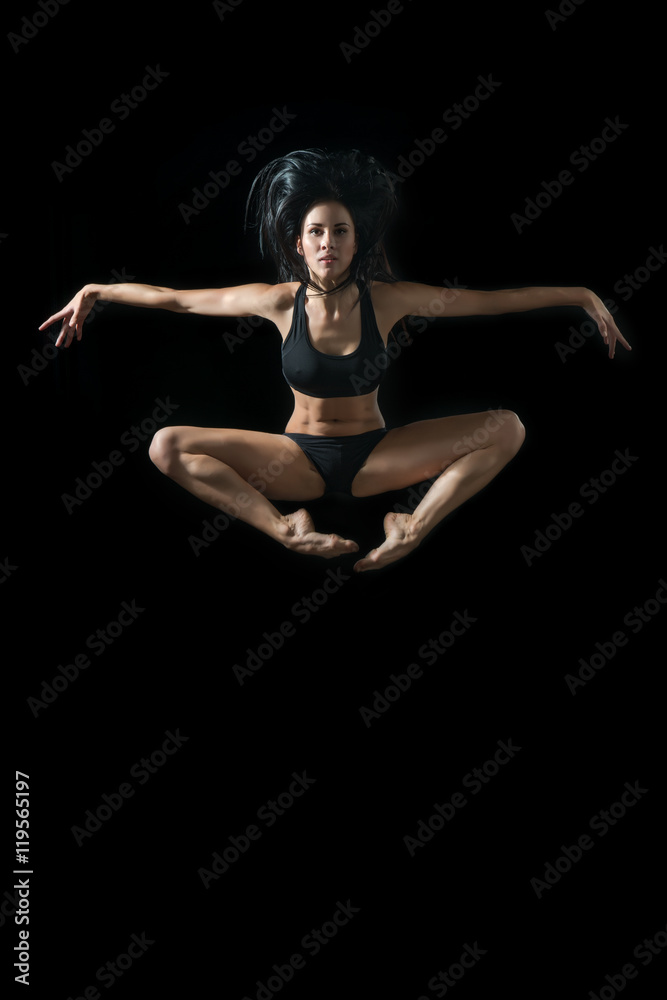 young ballet dancer dansing on white background