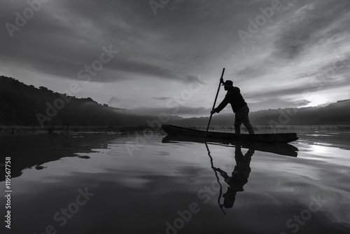 Wallpaper Mural Silhouette asian fisherman on wooden boat Torontodigital.ca