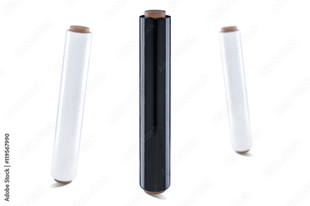 Rolls of black and white plastic stretch film on white background
