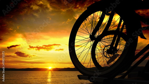 Bicycles on sunset background