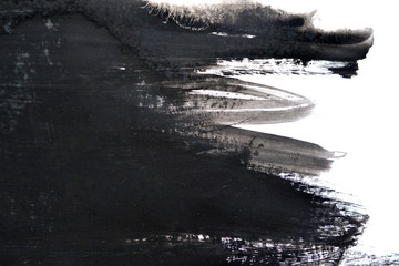 black brush strokes on white paper