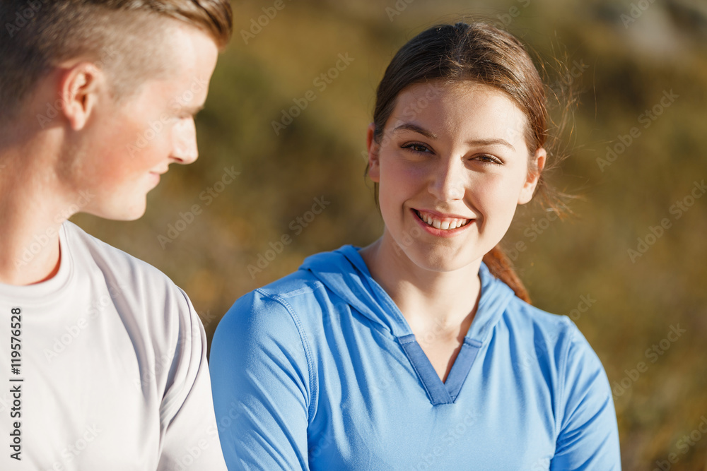 Young couple on beach training together Young couple on beach training together