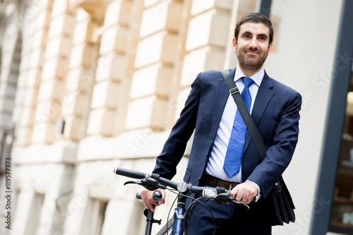 Young businessmen with a bike