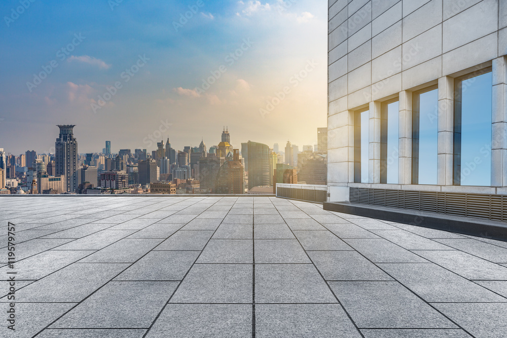 empty brick floor with city skyline background