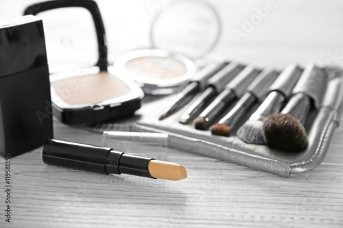 Professional make-up accessories on wooden table