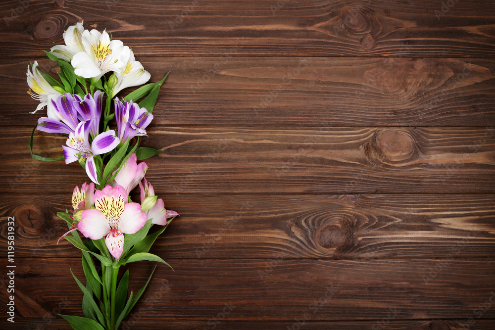 Fresh flowers on wooden background Fresh flowers on wooden background