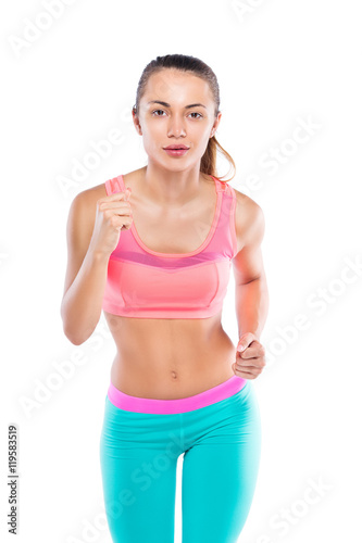 full length portrait of young fitness girl running isolated on w © Roman Ribaliov