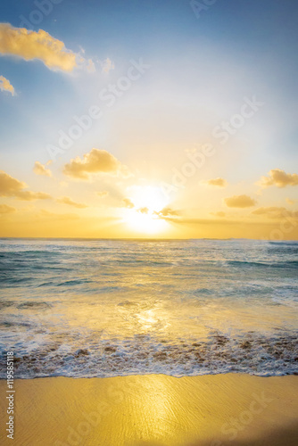 Golden sunset and a crashing wave