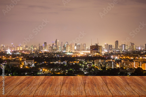 Empty wooden table over cityscape for your product display 