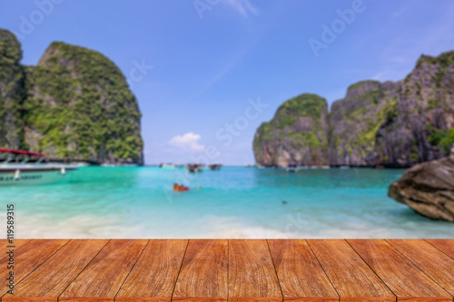 Wood table top on blurred beach background - can be used for dis