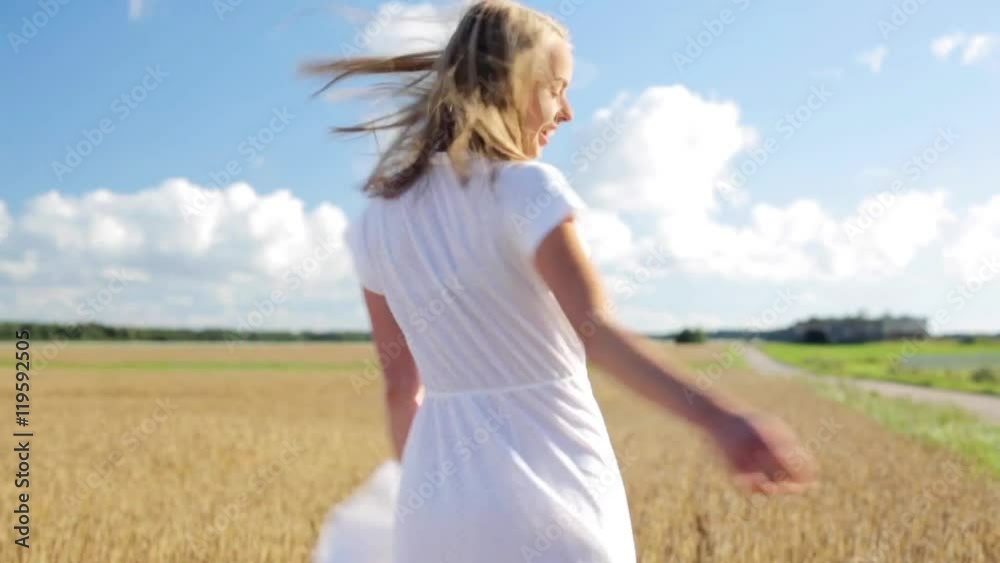smiling young woman in white dress on cereal field smiling young woman in white dress on cereal field