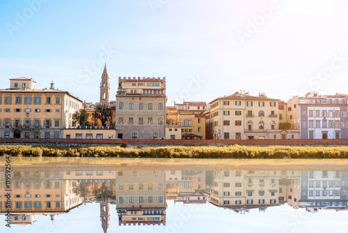 Cityscape view on the riverside with the old buildings and palaces near Holy Trinity bridge in Florence