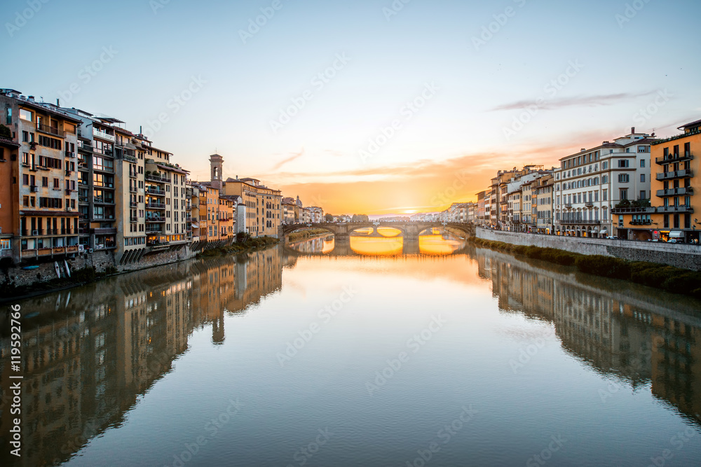 Cityscape view on Arno river with famous Holy Trinity bridge on the sunset in Florence