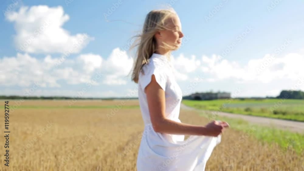 smiling young woman in white dress on cereal field smiling young woman in white dress on cereal field
