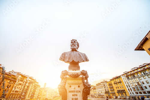 Benvenuto Cellini bronze statue on Ponte Vecchio bridge on the sunset in Florence photo