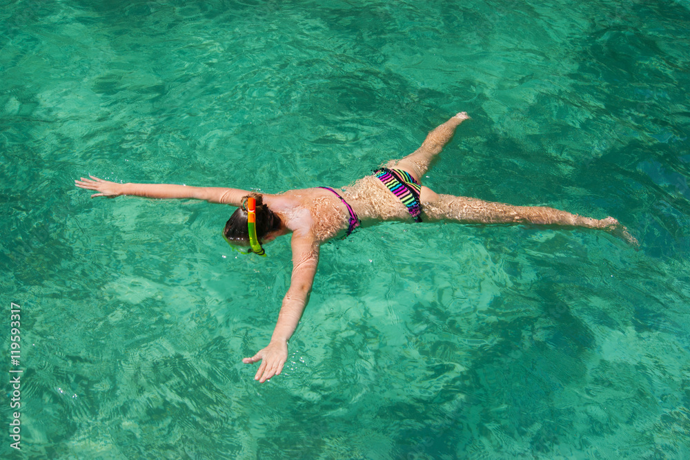 young girl on the beach snorkel Maya Bay on Phi Phi Ley