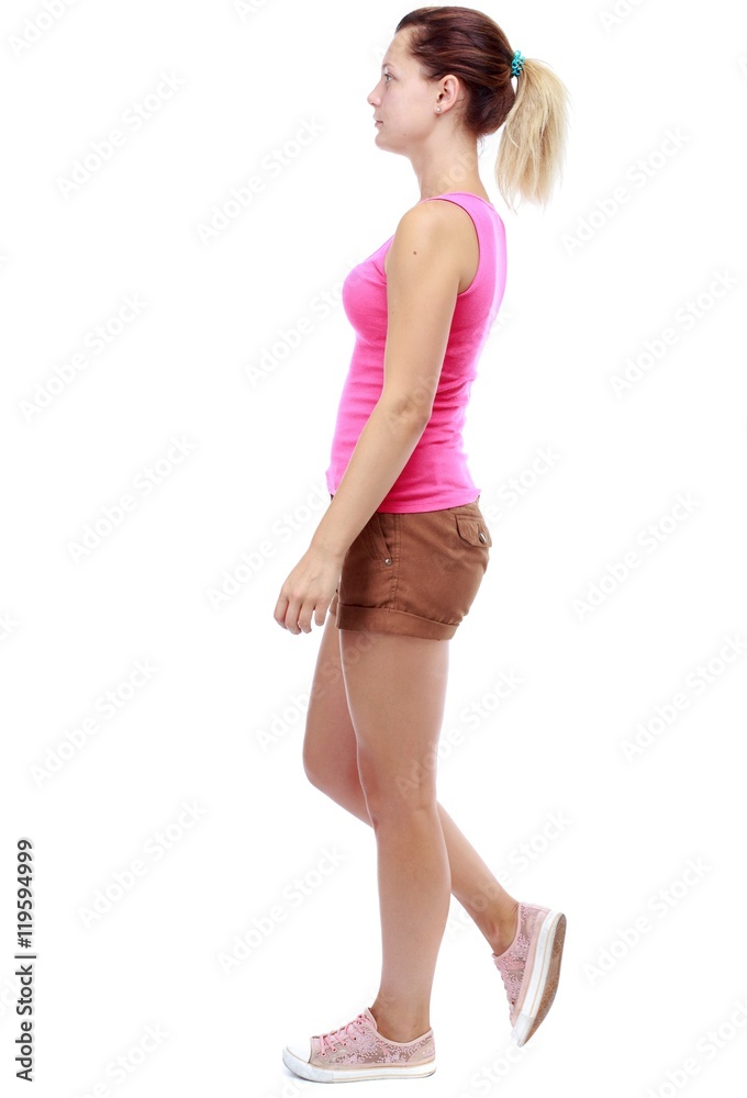 back view of walking woman . going gir in motion. Isolated over white background. Sport blond in brown shorts sadly passes. back view of walking woman . going gir in motion. Isolated over white background. Sport blond in brown shorts sadly passes.