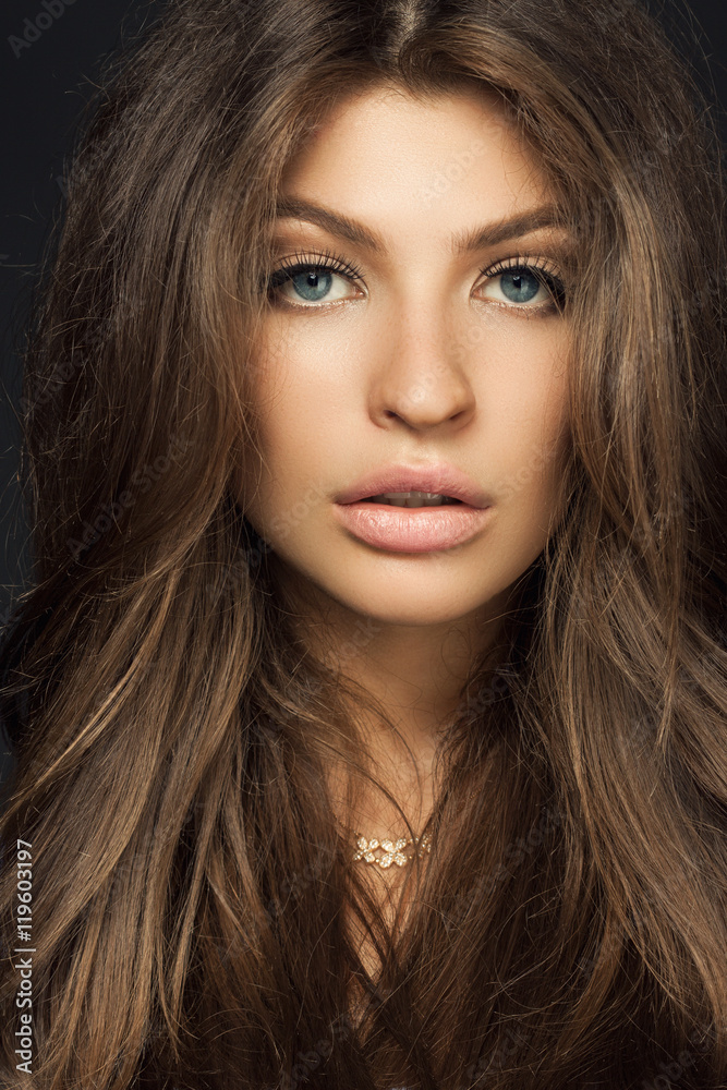 close up portrait of a beautiful woman with a voluminous hair an close up portrait of a beautiful woman with a voluminous hair an